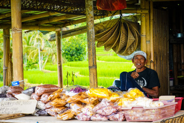 Warung keeper in Jatiluwih smiles at the camera