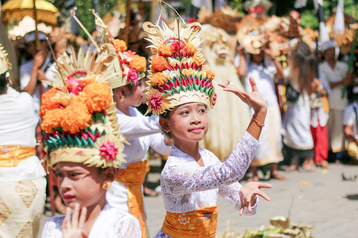 Bali kids are dancing at a temple anniversary